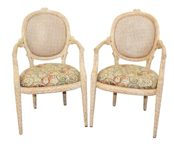 Pair of Naturalistic carved balloon back armchairs with caned back