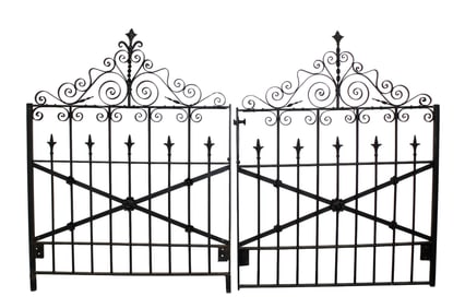 Pair of French scrolled iron garden gates with rosettes
