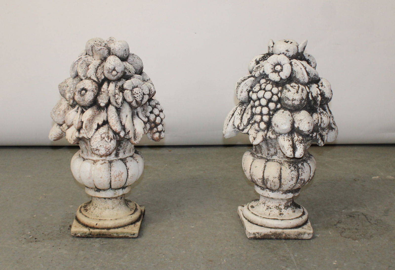Pair of Italian cast garden fruited urn finials: Pair of Italian cast garden fruited urn finials. 24"h x 7 3/4"w x 7 3/4" at base