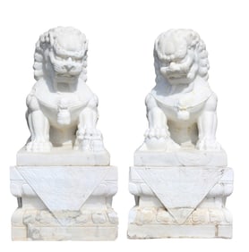 Pair of Chinese solid carved white marble foo dogs