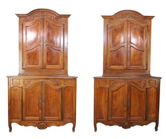 Pair of French Provincial corner cabinets in walnut