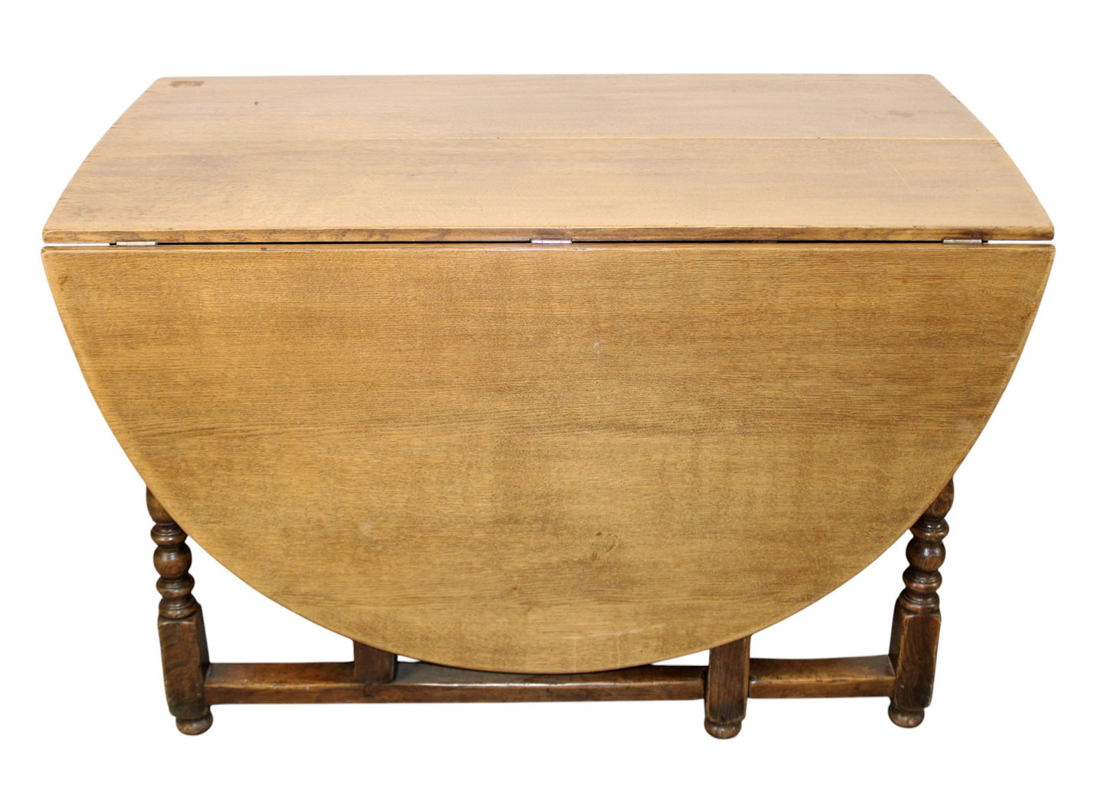 English drop side gate leg table in oak: English drop side gate leg table in oak. Single drawer. Mid 20th century. 29 5/8"h x 47 7/8"w x 72 3/4"l (25 3/4" with sides down)