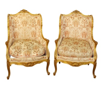 Pair of French giltwood Louis XV style bergère armchairs