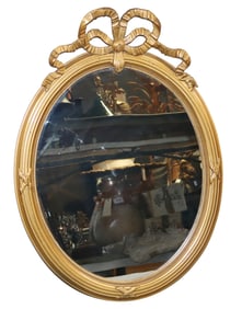 French Louis XVI style gilt wood oval mirror with ribbon