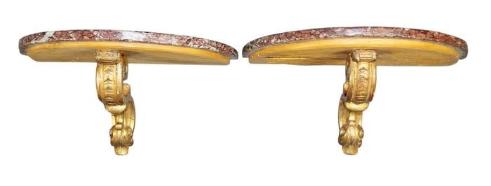 Pair of French giltwood demi-lune wall mount shelves with marble top.