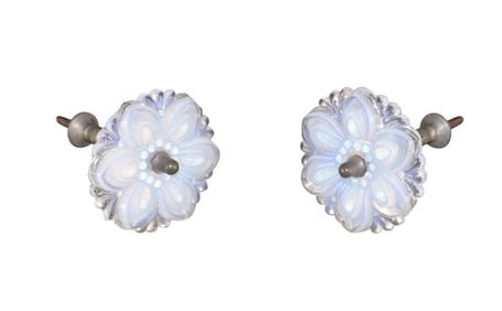 Pair of milk glass flower form curtain tie backs