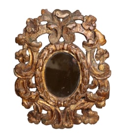 Italian relief carved giltwood oval mirror