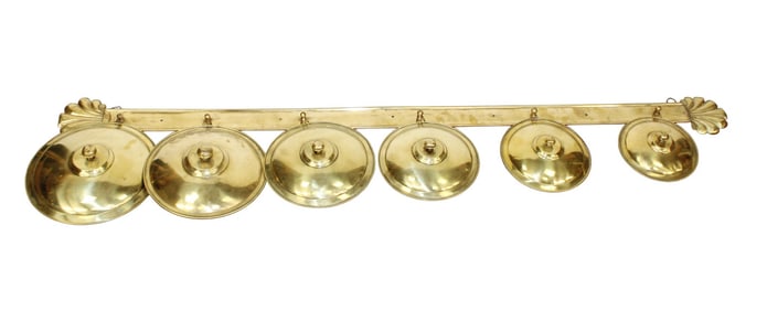 Set of 6 French brass pot lids on brass wall mount rack with scallop shells