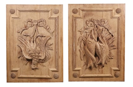Pair of French relief carved and bleached oak trophy plaques