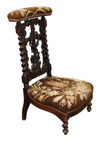 Black Forest relief carved walnut prayer bench (prie dieu) with cross