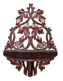 Black Forest wall shelf with carved oak leaves