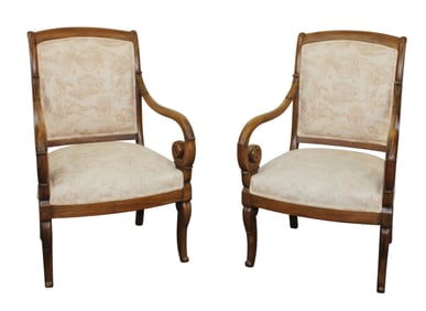 Pair of French Empire style armchairs in walnut with monochromatic toile upholstery