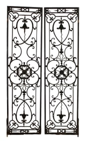 Pair of French wrought iron entry doors with leafy detail