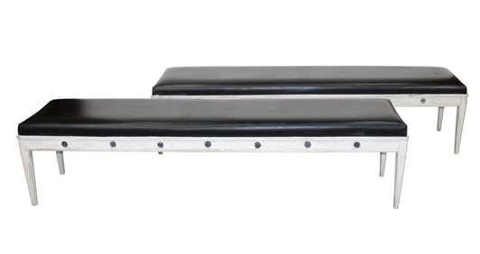 Pair of French painted pine backless benches on tapered legs with rosettes and leather seats