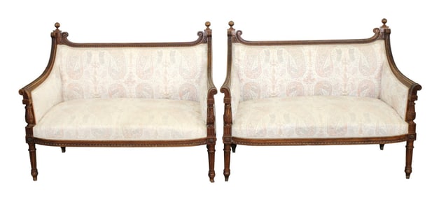 Pair of French Louis XVI style settees in carved walnut