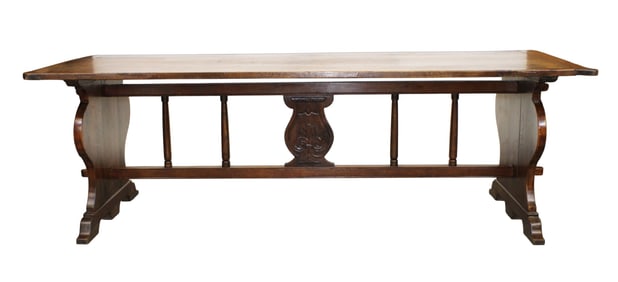 French refectory table in walnut with shaped supports and colonnade stretcher