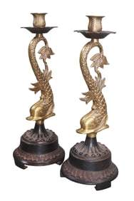 Pair of mythological dolphin form candlesticks