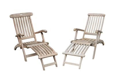 Companion pair of teak lounge chairs