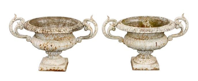 Pair of French cast iron pedestal urns with handles