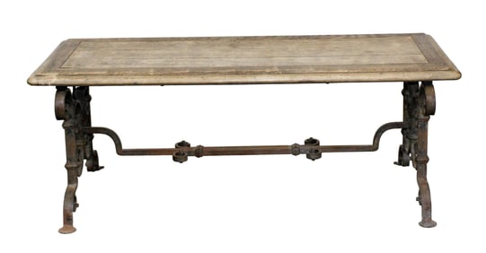 French coffee table with scrolled iron base and weathered oak top