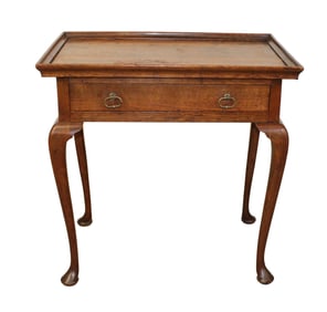 English Queen Ann cabaret table in oak with pad feet and single drawer