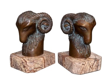 Pair of bronze rams head bookends on marble bases