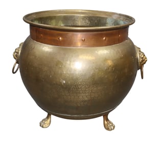 Polished brass and copper footed cachepot with lion heads