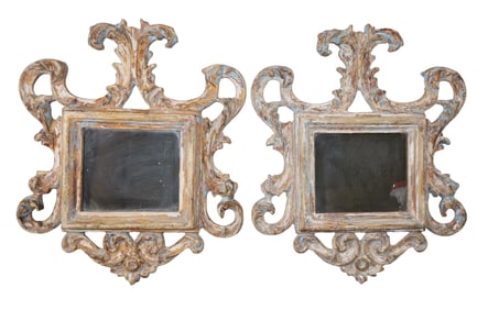 Pair of Italian carved and polychrome wood framed mirrors