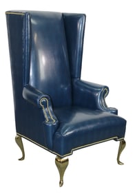 Modern high back textured studded leather wing back chair on stainless feet