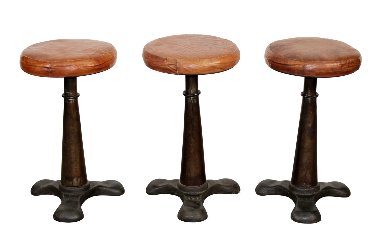 Lot of 3 Singer cast iron adjustable sewing stools with leather seats: Lot of 3 Singer cast iron adjustable sewing stools with leather seats. Early 20th century. 21" - 24 1/2"h x 12 1/4"dia