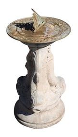 Bronze sundial on concrete mythological dolphin base