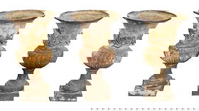 Lot of 3 Italian cast iron garden urns with floral garland in relief: Lot of 3 Italian cast iron garden urns with floral garland in relief. 21st century. 30 1/8"h x 16 3/4"dia