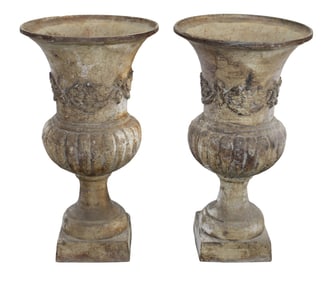 Pair of Italian cast iron garden urns with floral garland in relief