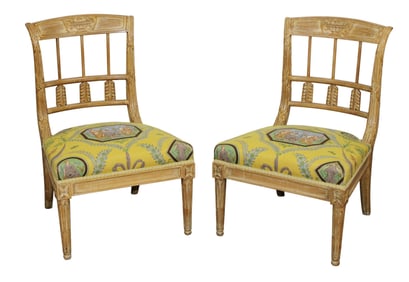 Pair of Adam style low parlor chairs with carved urns