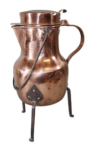 French polished copper pitcher on iron feet