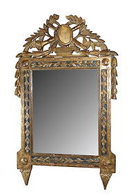 French Louis XVI style gilt wood carved mirror: French Louis XVI style gilt wood carved mirror with musical themed crest and laurel leaves. Late 19th century. 39"h x 23"w