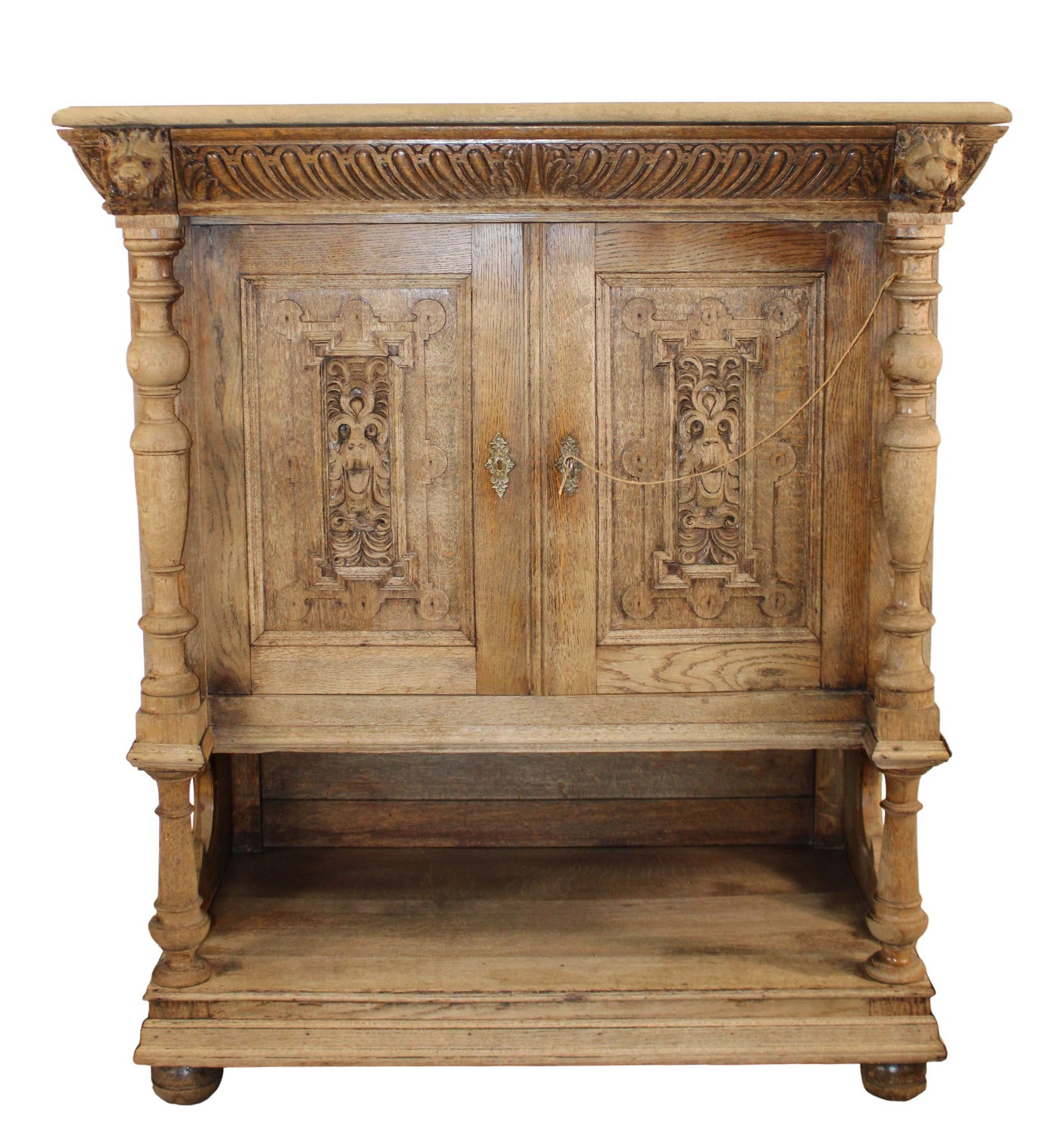 French carved oak buffet with lion heads: French carved oak buffet with lion heads. Late 19th century. 48 3/4"h x 43"w x 23 1/2"d