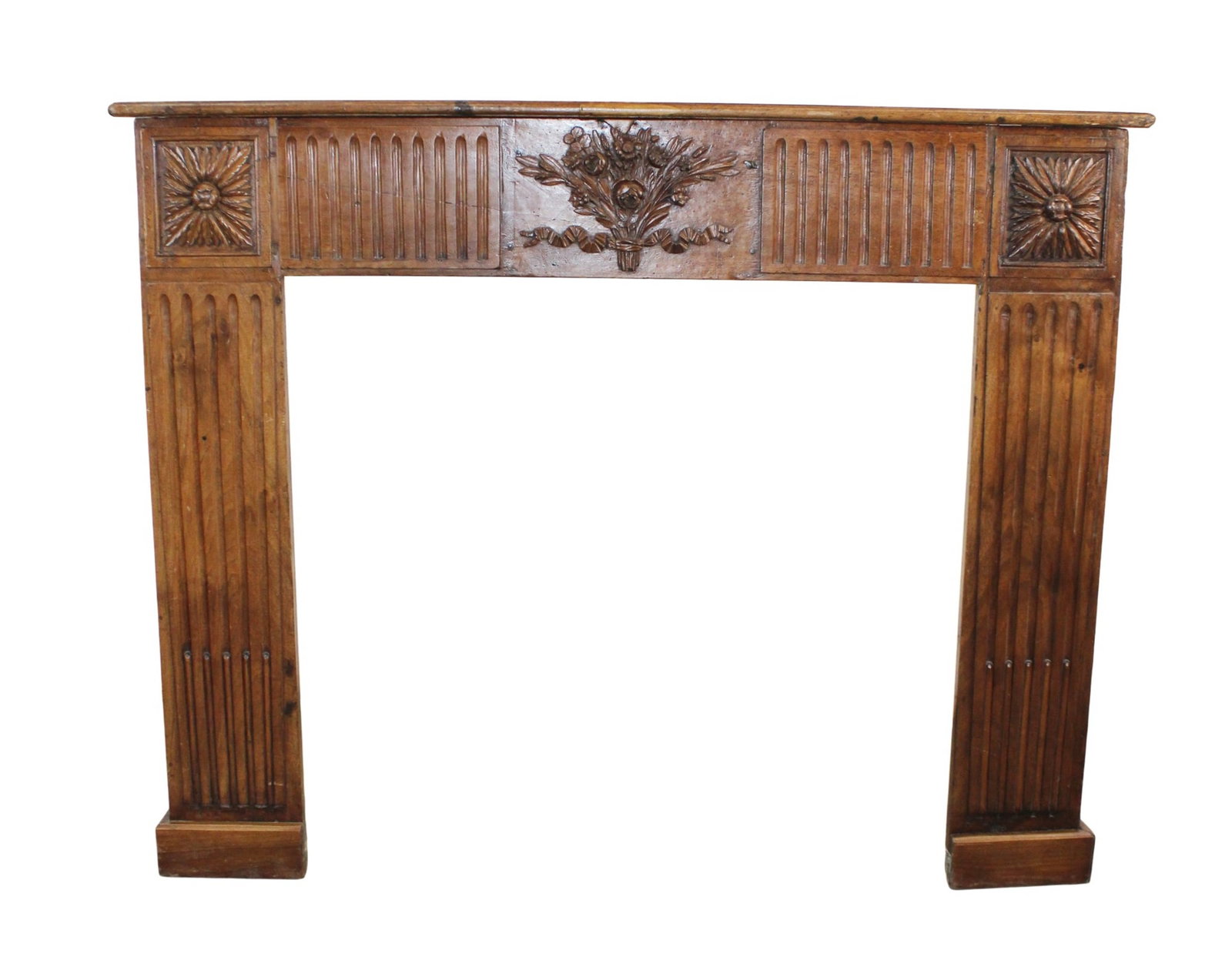 French Louis XVI style mantel with a bouquet and sunflowers carved on the frieze: French Louis XVI style mantel in walnut with a bouquet of sunflowers carved on the frieze. Mid 20th century. 42"h x 56 1/2"w x 10"d