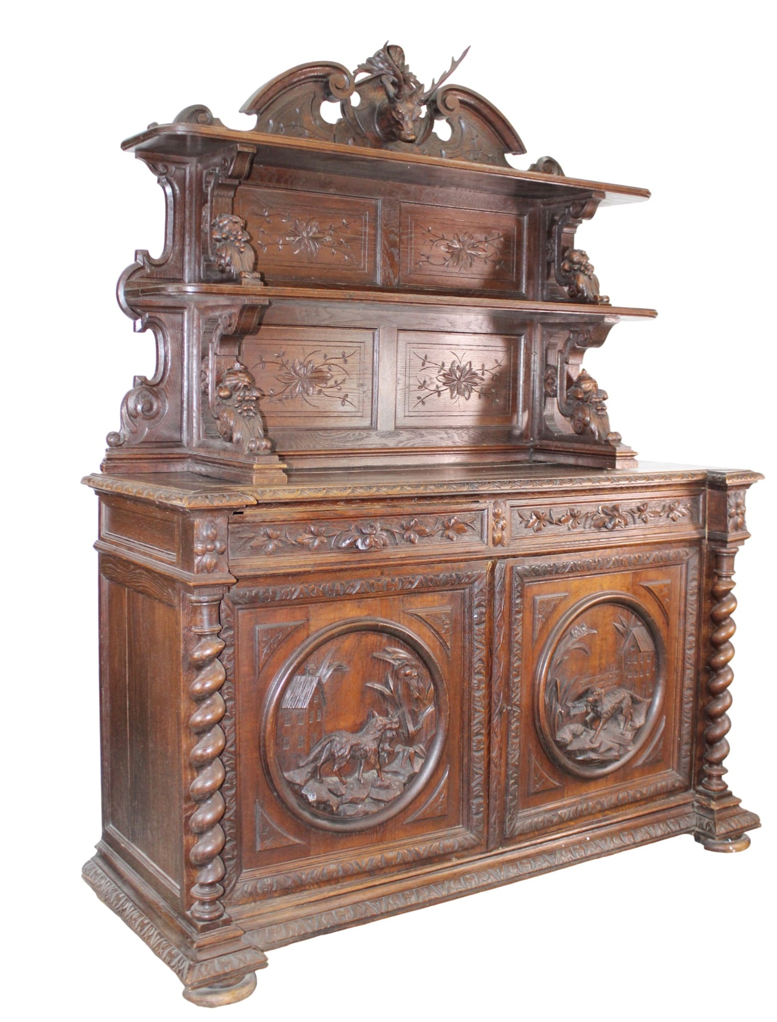 French carved oak buffet St. Hubert with deer head crest: French carved oak buffet St. Hubert with deer head crest. 19th century. 80 1/2"h x 64 1/4"w x 24 1/2"d.