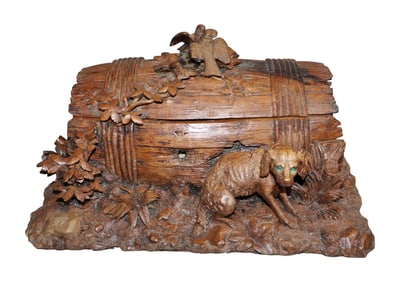 Black Forest carved walnut barrel form dresser box with dog and birds