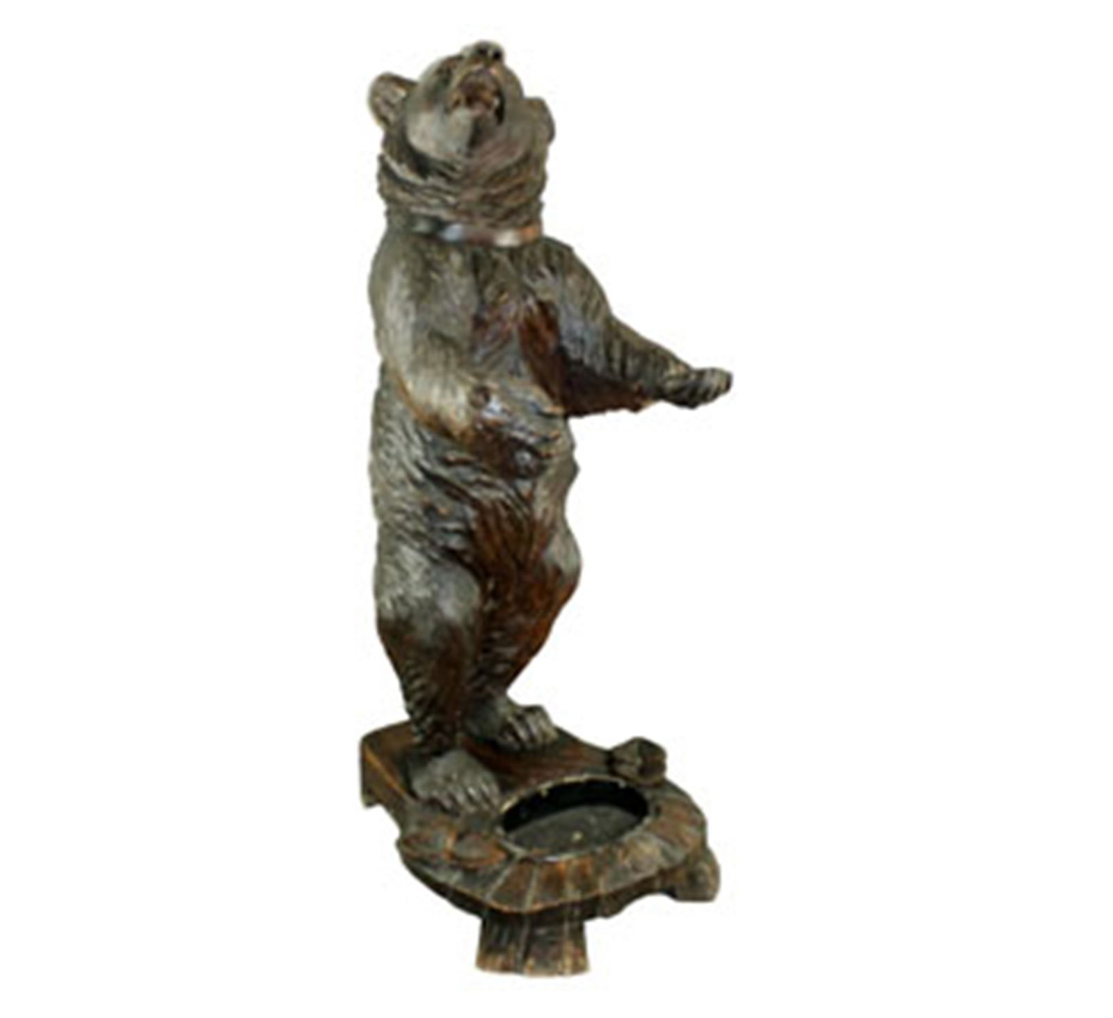 Black Forest carved life-size bear cub: Black Forest carved walnut bear umbrella stand. Bear has glass eyes. Late 19th century. Overall: 42 1/4"h x 16 3/4"w x 20"d.