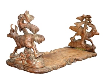 French Black Forest book stand in carved walnut with antelopes