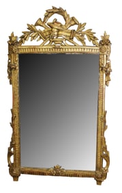 French Louis XVI gold leaf mirror with carved musical elements and laurel wreath