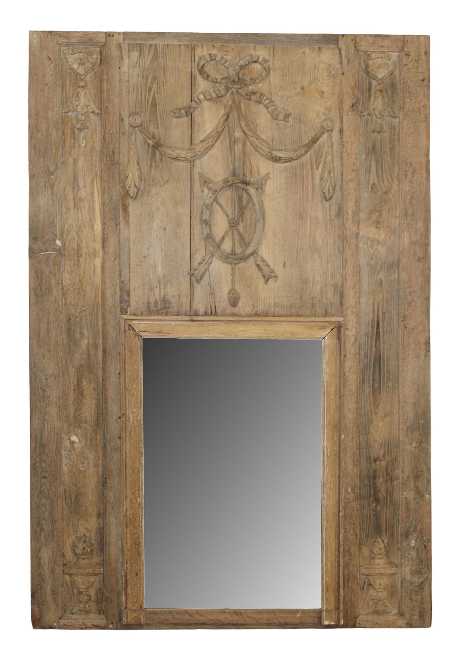 French Louis XVI trumeau mirror in weathered oak with crossed arrows: French Louis XVI trumeau mirror in oak with carved crossed arrows ribbon, bow and draped garland. Late 18th century. 77 1/2"h x 52 3/8"w