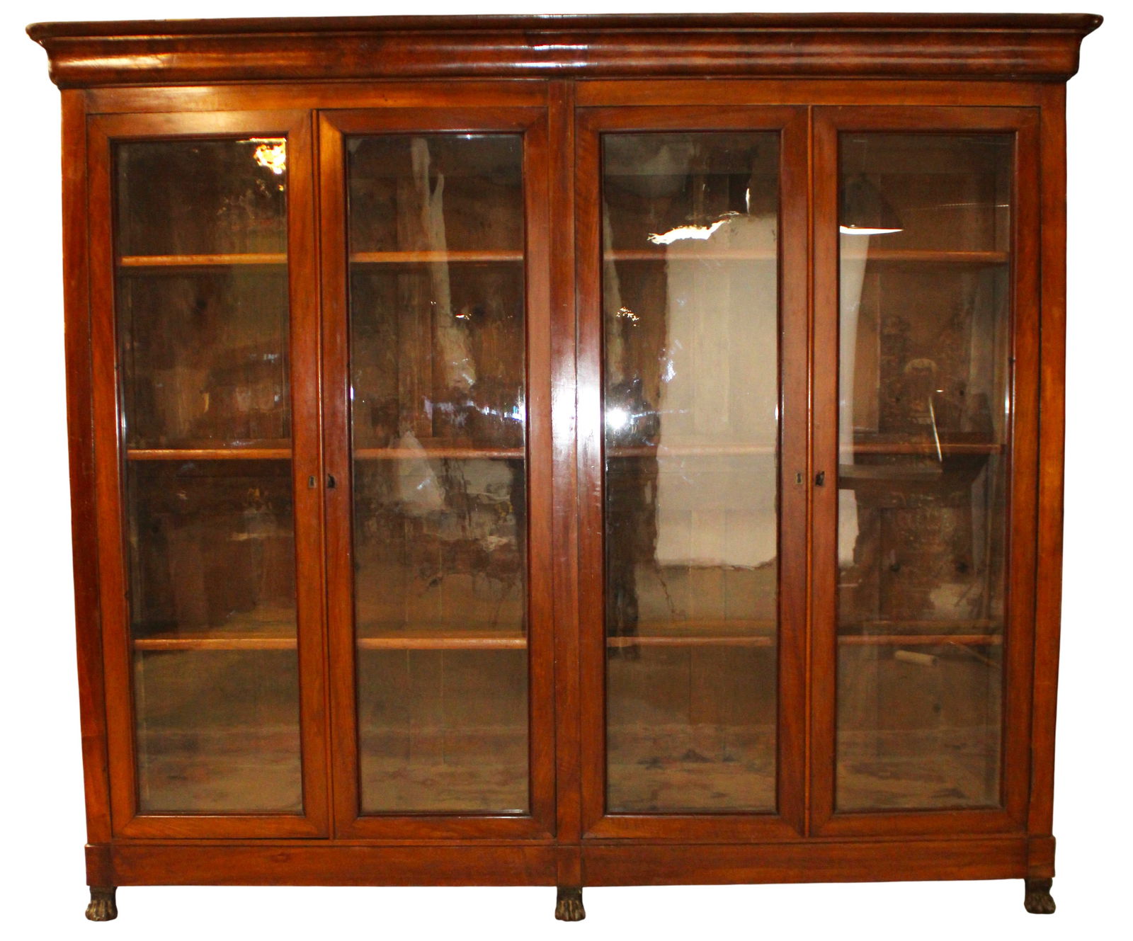 French Louis Philippe 4 door bookcase in walnut: French Louis Philippe 4 door bookcase in walnut. 19th century. 94"h x 104 3/4"w x 18 1/2"d