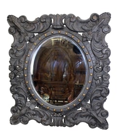 Arhaus ebonized and carved Rococo style mirror
