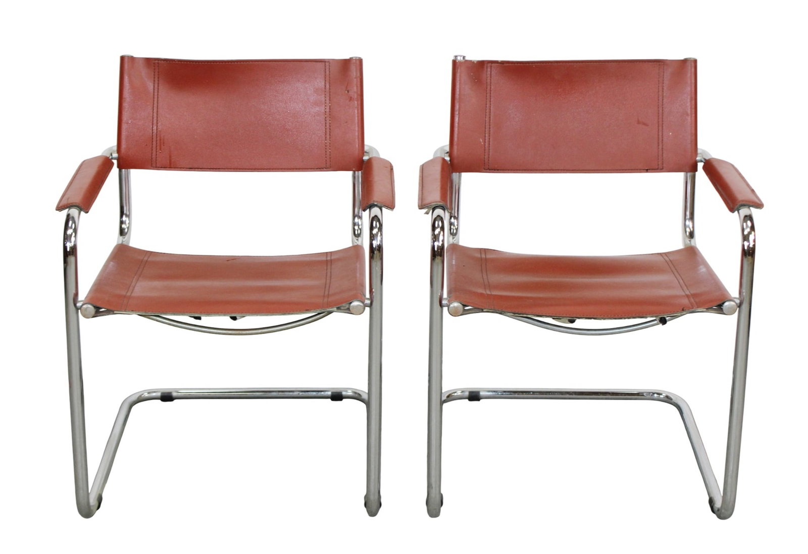 Pair of Marcel Breuer leather and chrome cantilever chairs: Pair of Marcel Breuer (attributed) leather and chrome cantilever armchairs. Mid 20th century. 30 3/8"h x 24"w x 20"d, seat height 18"