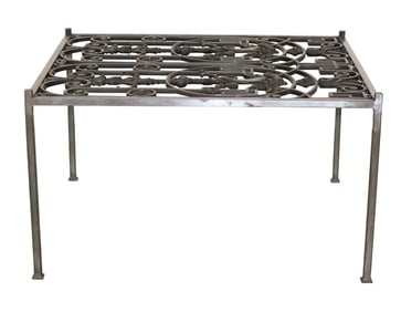 Wrought iron panel mounted as coffee table