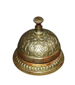 Ornate brass hotel front desk bell