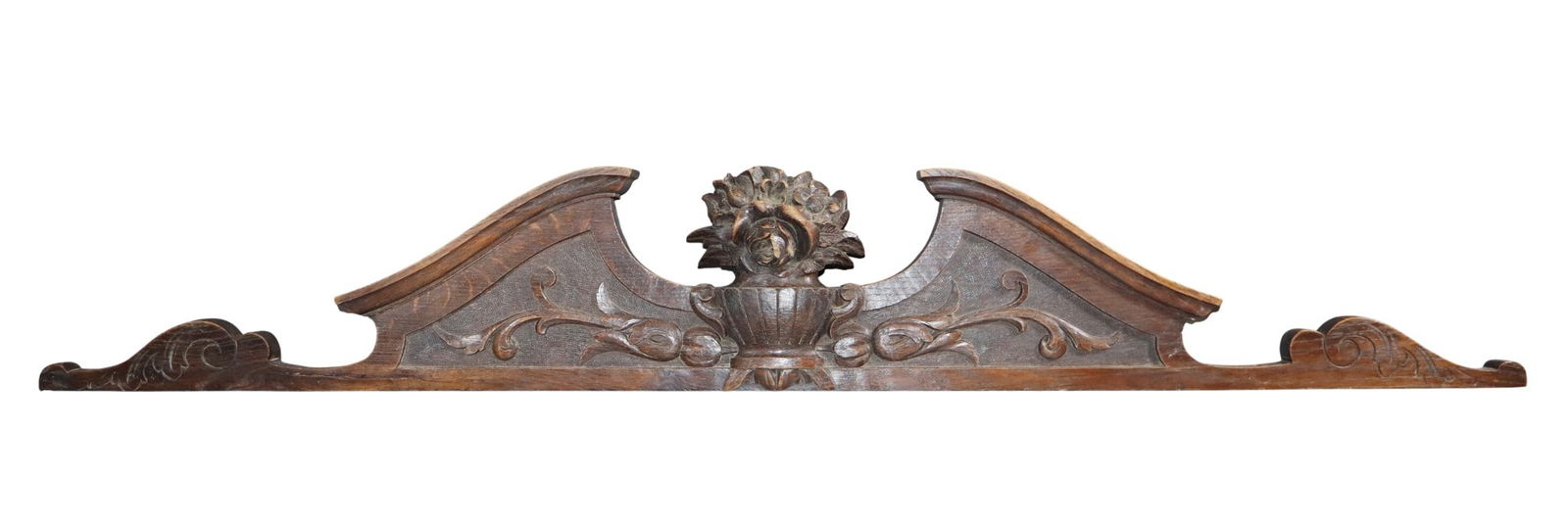 French carved oak overdoor crest with flowering urn: French carved oak overdoor crest with flowering urn. Late 19th century. 7 1/2"h x 50"w x 2 1/2"d Weight: 14lbs